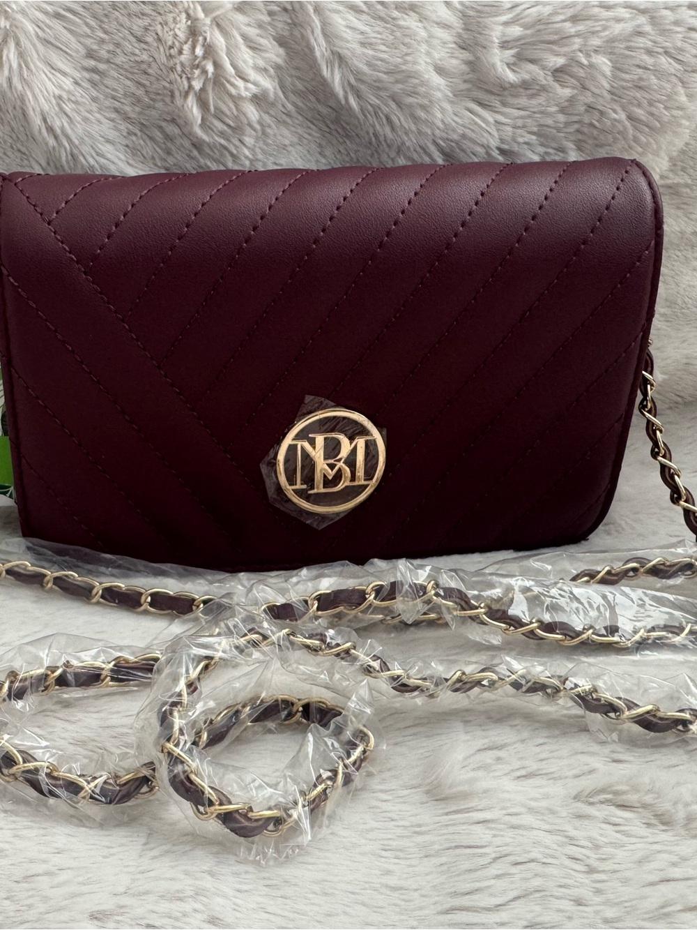Jewel Badgley Mischka Quilted Wine Crossbody with Gold Logo